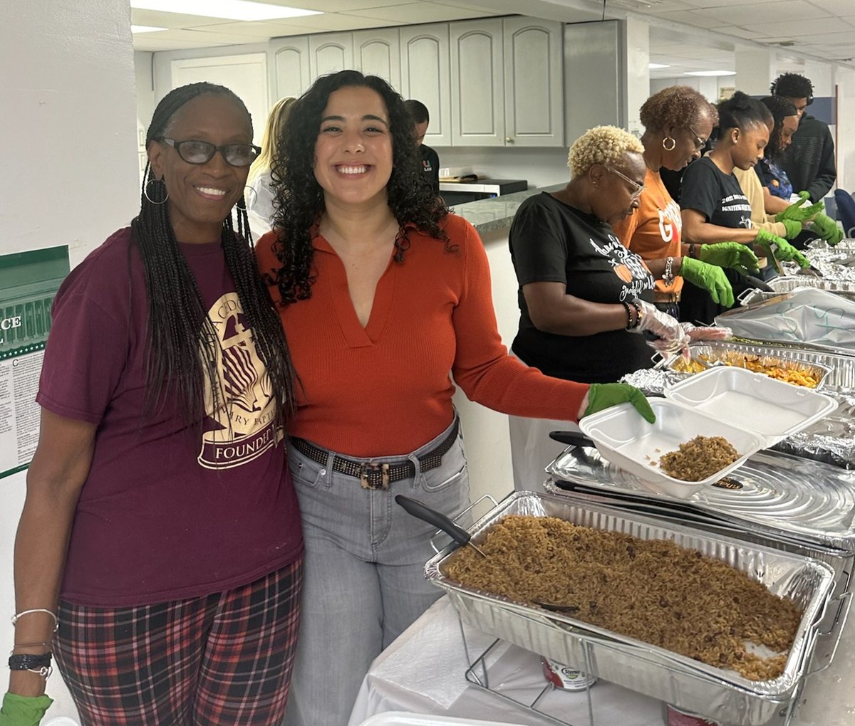 Senator Calatayud serving meals with faith community leaders