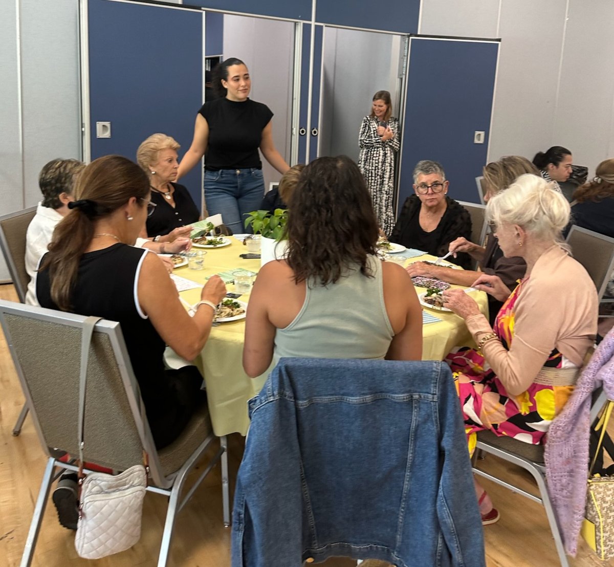 Senator listening to seniors at a community luncheon