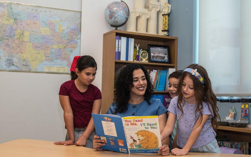 Senator reading to students at school